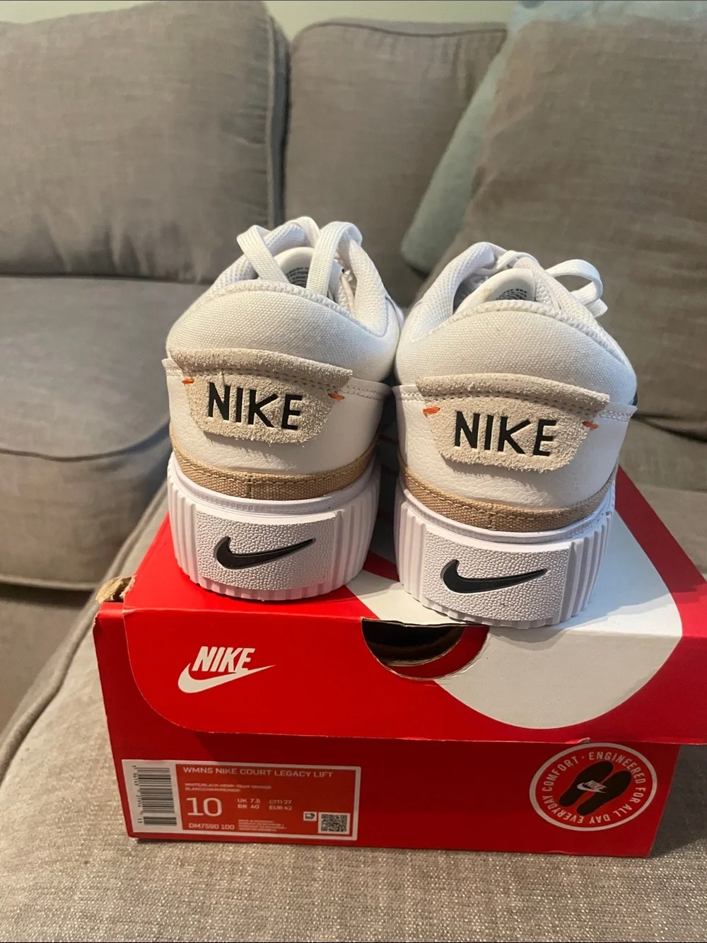 Nike womens White Low-Top Sneakers with Black Swoosh and Tan Accent - Picture 2 of 4